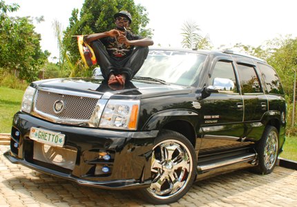 Bobi Wine and his Escalade. He is set to hold a mega concert on Saturday 18th october athis Busabala beach
