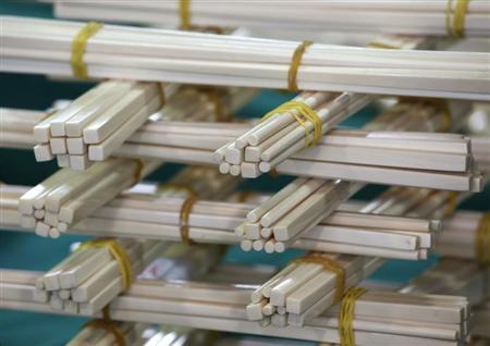 Ivory chopsticks seized by the Hong Kong Customs and Excise Department are displayed during a news conference in Hong Kong