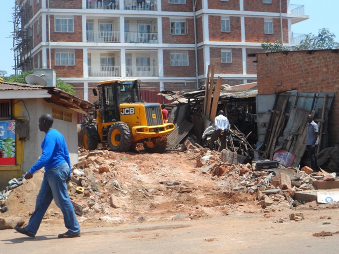 Residents watch in pain as their kiosks are being demolished.