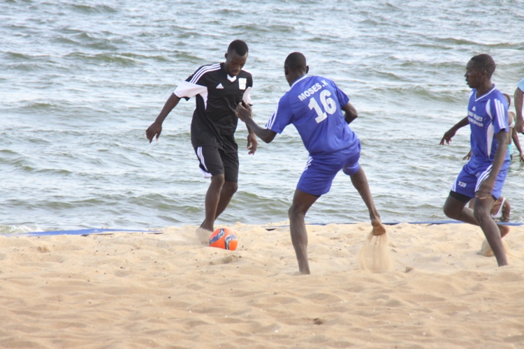 Uganda Sand cranes deputy captain Muganga Douglas (in black) in action against Team select on Saturday.
