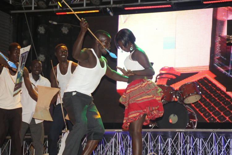 Acholis on stage performing their traditional dance.
