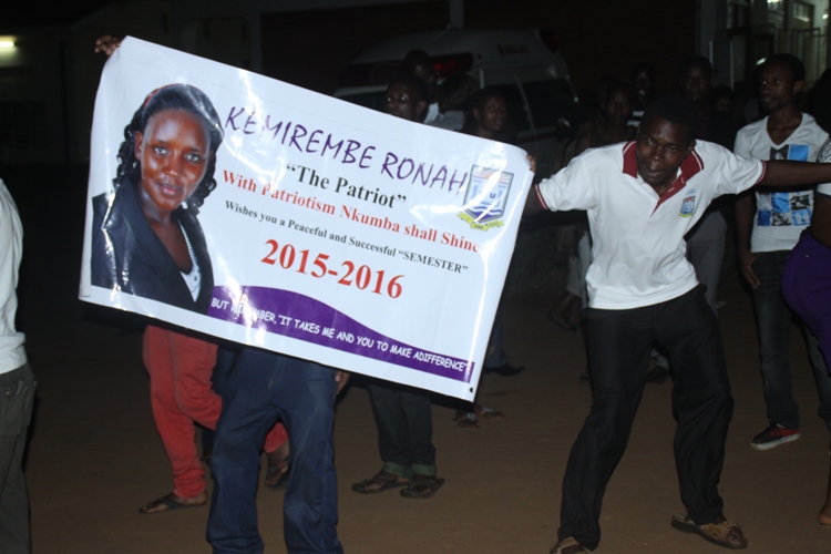 Kemirembe Ronah's supporters with her banner campaign recently at the University.