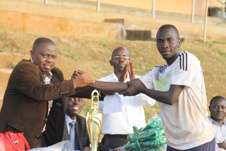 Top scorer Osuta Herbert shakes hands with Justus Mugisha.