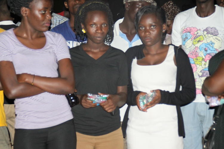 Babes holding Waragi Sackets tight.