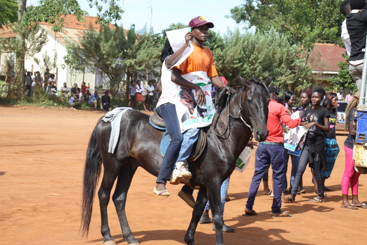 Kirumira's supporter on a horse.