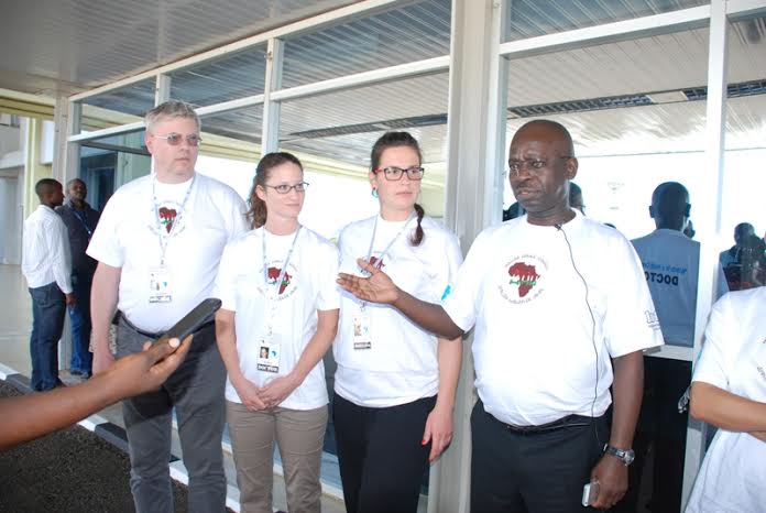 Minister Shinyabulo Mutende (L) Welcoming Africa -Hungarian Union Doctors At Entebbe Airport