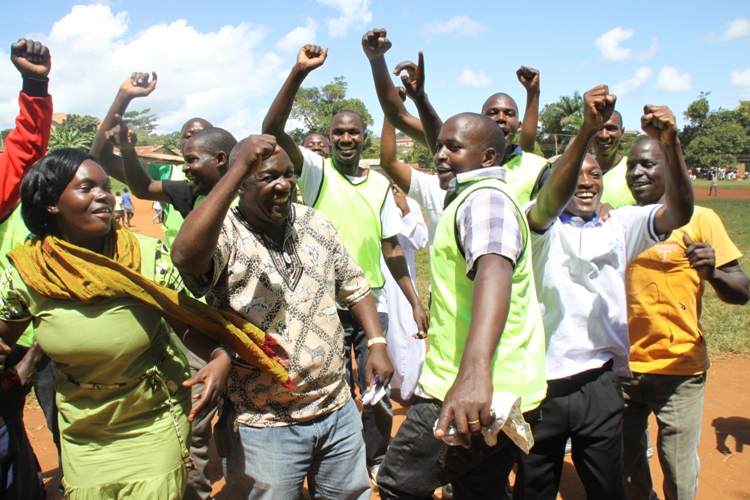 Segujja with supporters after a football tournament at the Kiwafu Play ground.
