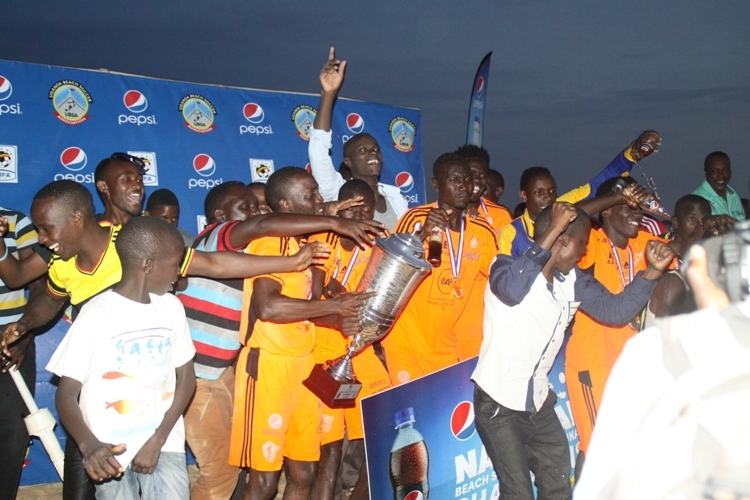 MUBS Players rejoice after receiving the Pepsi Beach Soccer League Title.