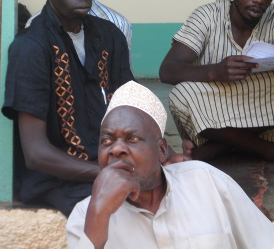 Sheikh Muziru Ali being paid peanuts of Shs 30,000 for leading prayers at the mosque.