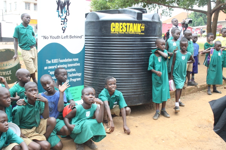 Namaate Primary School pupils feeling sweet with the water tank.