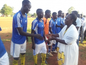 Hon Rose Tumusiime greeting the teams before the match kick off.