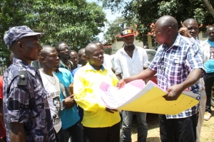 Police confiscate placards from Lyto Boss' supporters at the court premises.