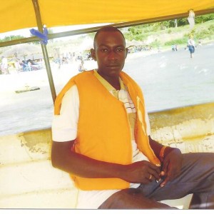 Norman Kampororo aka Rutimburana enjoying a boat cruise.