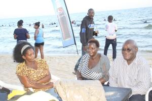 Aspiring Mayor Joseph Ssesanga with babes at Lido Beach.