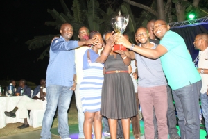 Entebbe Club players  flying high with trophy.