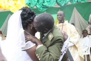 Lt. Ruyondo kissing babe by force.