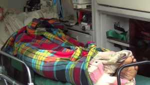 The deceased's body in the ambulance.