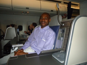 Kenneth Bainomugisha smiling in SN Brussels Aircraft.