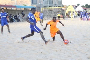 MUBS player (in orange) in action on Saturday.