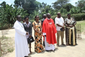 Mary Reparatrix Board Chairman Rev. Fr Francis Byarugaba (in white), Headmistress Sanyu (third from left) and Dr. Ssemusu Lawrence with Parents addressing the press.