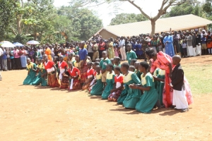 Nakiwogo school kids present a poem.