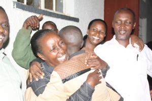 Rose Tumusiime receives a congragulatory hug from her diehard supporter.