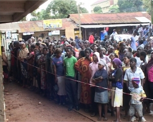 Kitooro Residents surround the storied building after discovering the deceased's body.