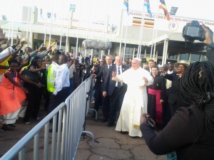 An excited Pope Francis after arriving at Entebbe Airport.