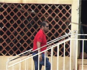 Fish Ways Boss Safaraz walking into Entebbe Police station.