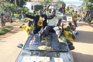 George Ntoganyi (R) making noise with his supporters.