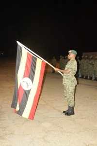 Maj. Gen. Wilson Mbadi with Ugandan Flag.