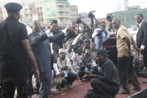 Mbabazi flashes Go-forward symbol.