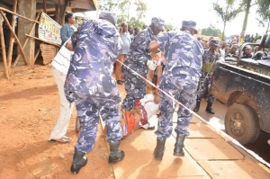 Police Officers Carrying Rita's Body