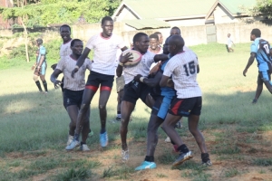 Rams players (in white) rough up a mongers player.