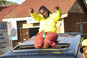 Soupy babe feeling sweet on top of car.