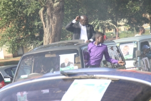 Stanley Namayirira flashing the DP Fist symbol.