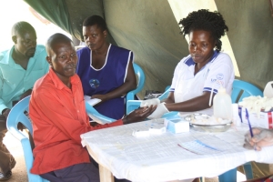 A man voluntarily tests for HIV at the celebrations.