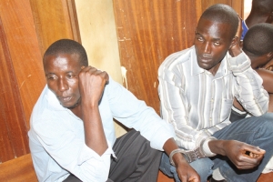 Allan Aliseka (R) and Mugenyi Mohammed the conductor at the Entebbe magistrate court on Monday.