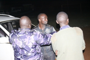 Foot Patrol cops surround Horny Sembatya Norman at the Nkumba Play Ground.