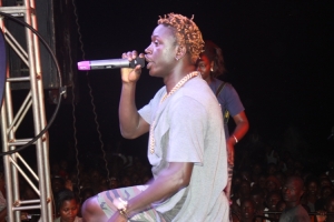 Gravity Oumutujju on stage.