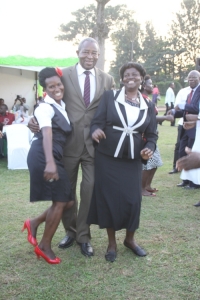 Minister Bucyanayandi sandwiched by babes.