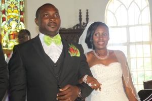 Muhavura Farm House Boss Jimmy Abomugisha  smiling sweet after exchanging marriage vows with sweet Sylvia.