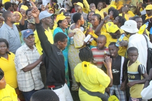 NRM supporters mob Rose Tumusiime and RoseMary Sseninde last week at the leisure park.