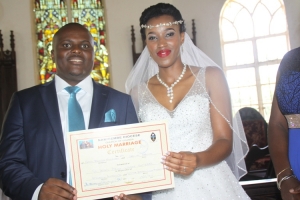 Sweet Couple Enock Nuwagaba with light skinned Carol after exchanging marriage vows.