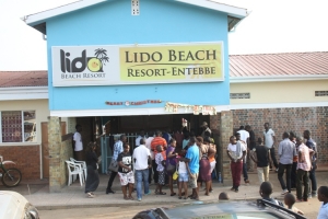 A handful of people at the Lido Beach entrance.