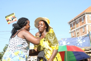 NRM Flag bearer Rose Tumusiime (R) with her die-hard supporter.