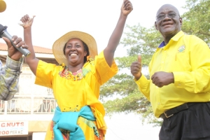 NRM's Rose Tumusiime smiles to her supporters as Mayoral Candidate Joseph Ssesanga looks on.