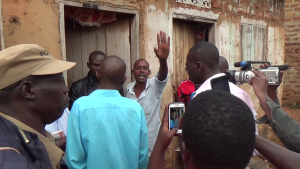 Sex Hungry Moses Byaruhanga threatening cameramen.