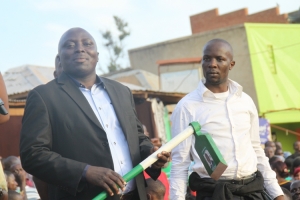 Stanley Namayirira threatening to uproot Segujja Anthony from office with hoe.