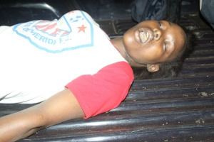 The deceased on a police pick up truck.